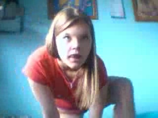 Redhead girl takes off sexy jeans and caresses herself