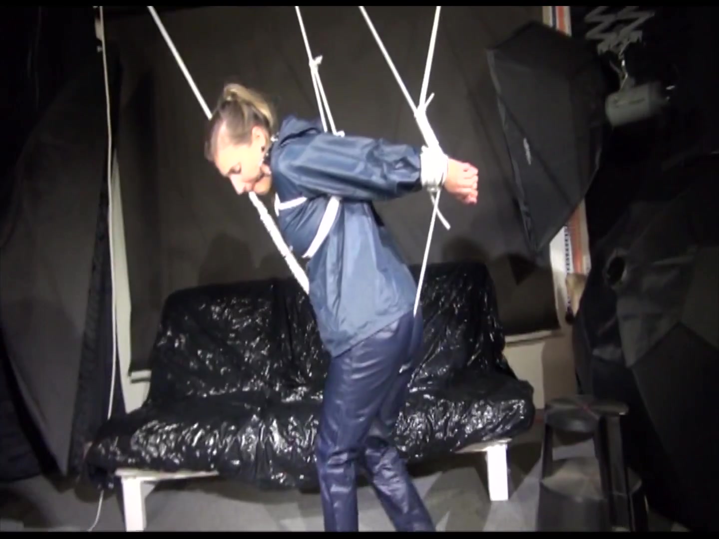 Get 2 Videos With Sandra Enjoying Bondage In Her Shiny Nylon Rainwear From Our 2016 Archive