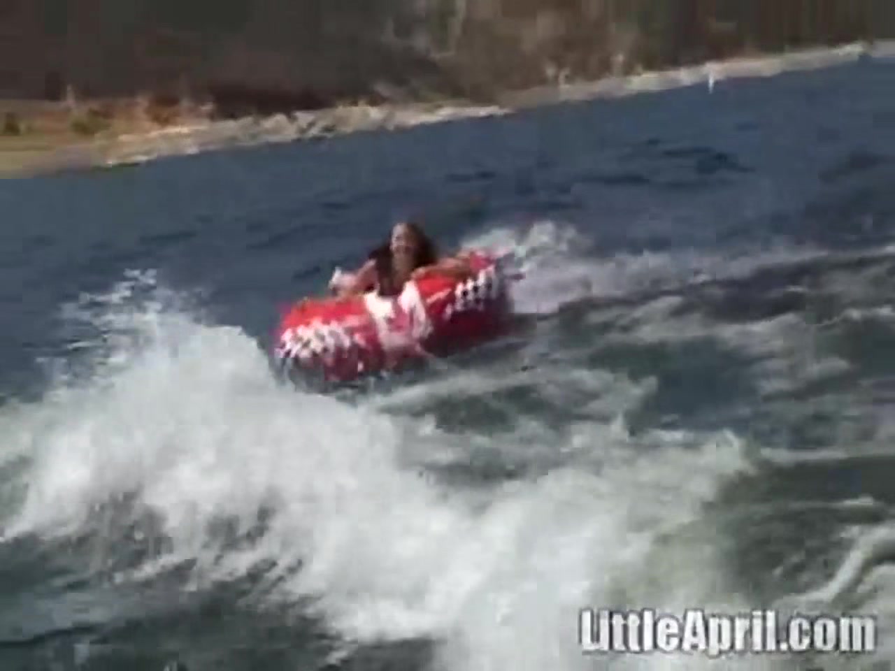 Sexy teen 18+ Little April playing with her snatch outdoors in rubber boat