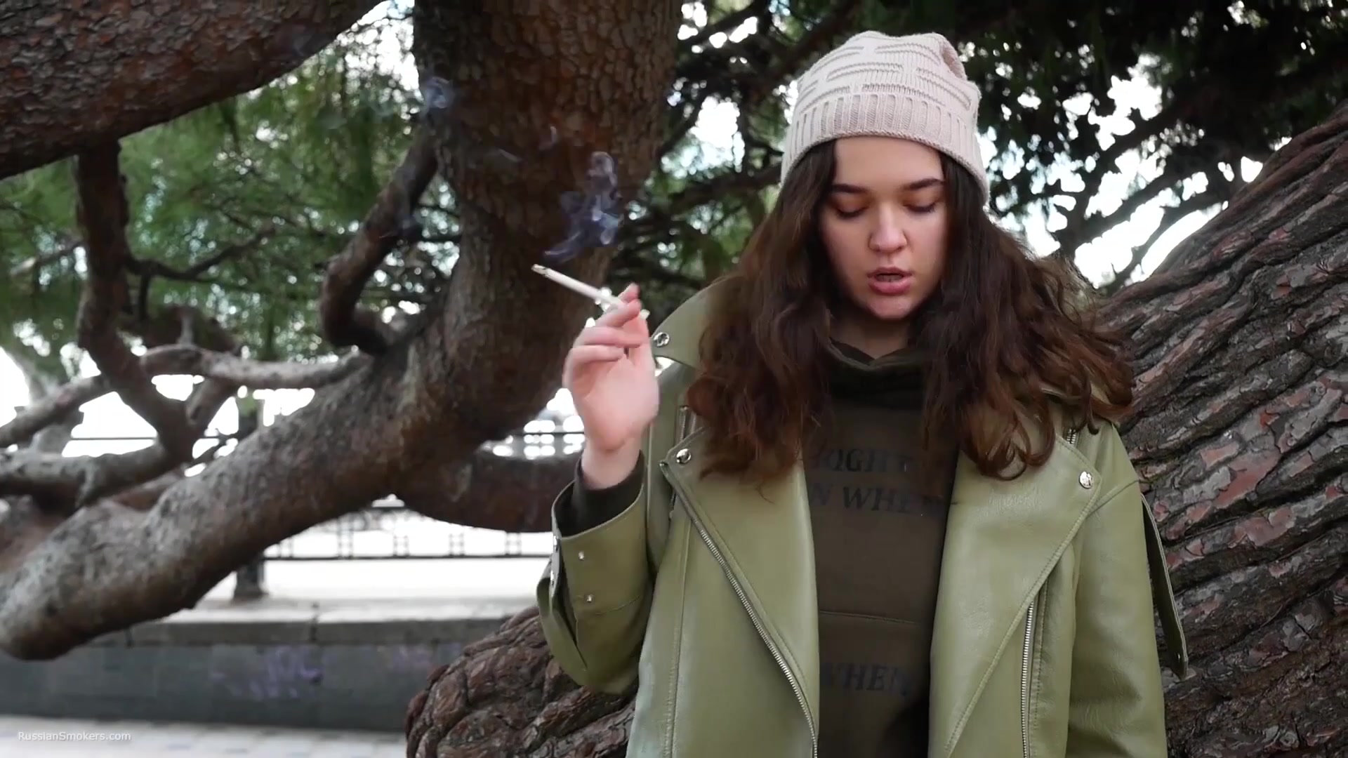 Young Brunette Is Taking An Unhurried Stroll With Allwhite 120mm Cigarette
