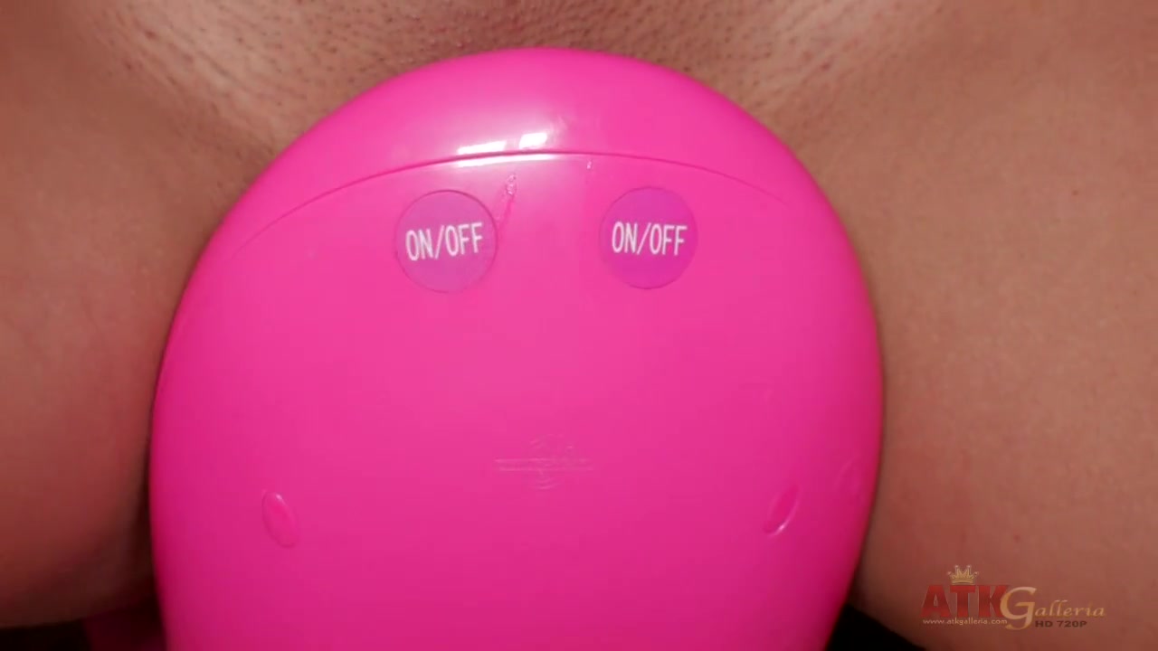 Exotic brunette riding a toy