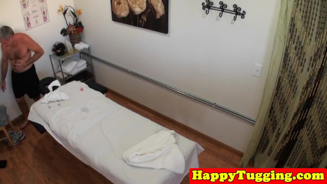 Asian masseuse sixtynines client on table