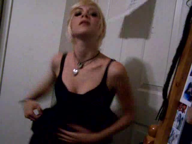 Short-haired blonde girl dances in the homemade video