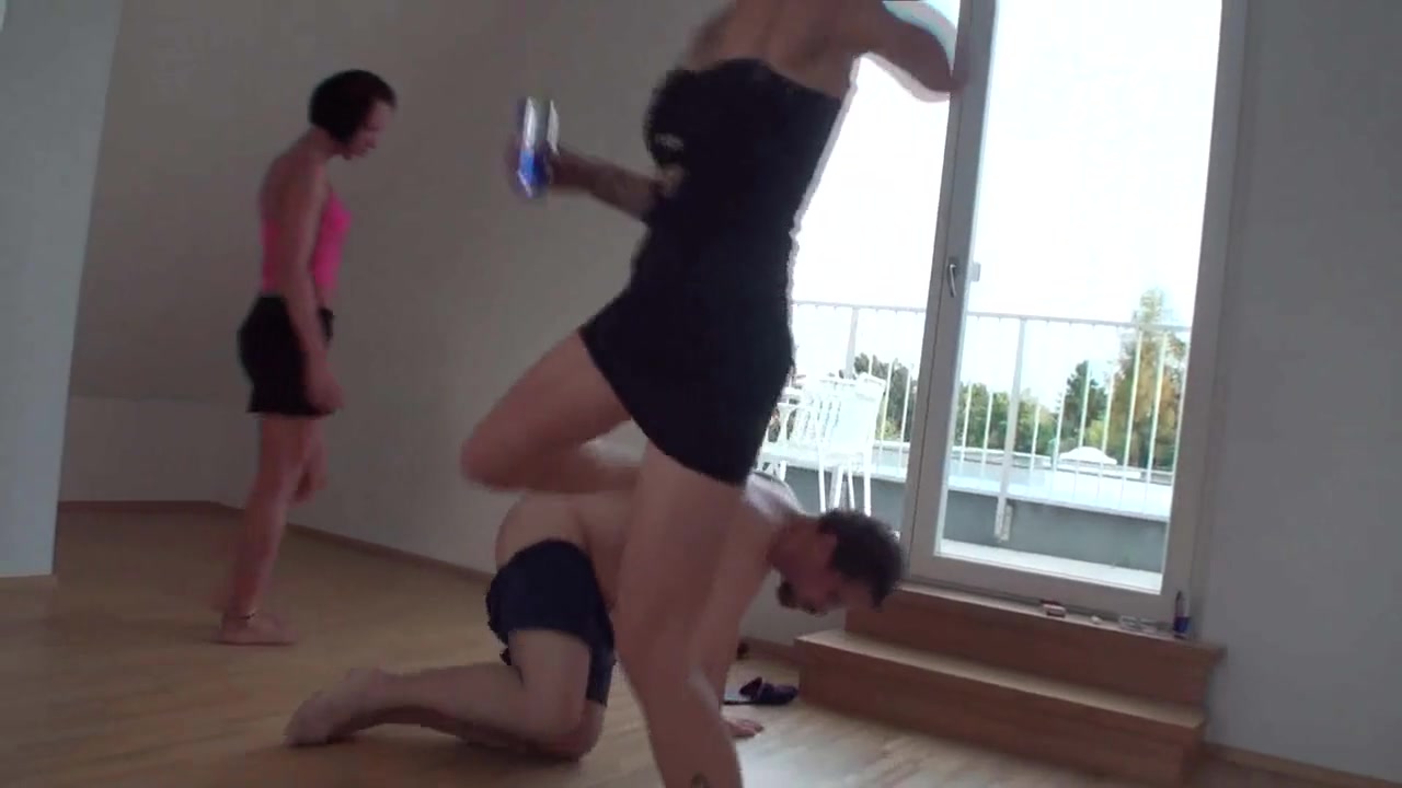 A threesome of slave kicking by Femdom Austria