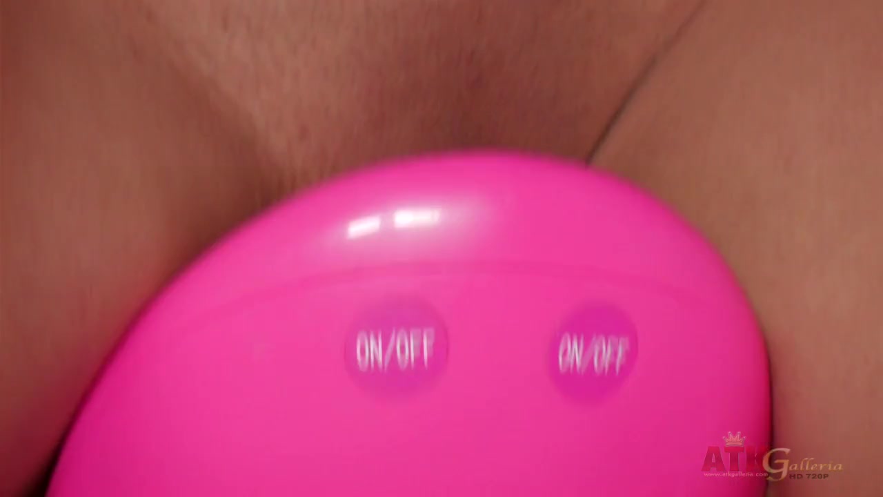 Exotic brunette riding a toy