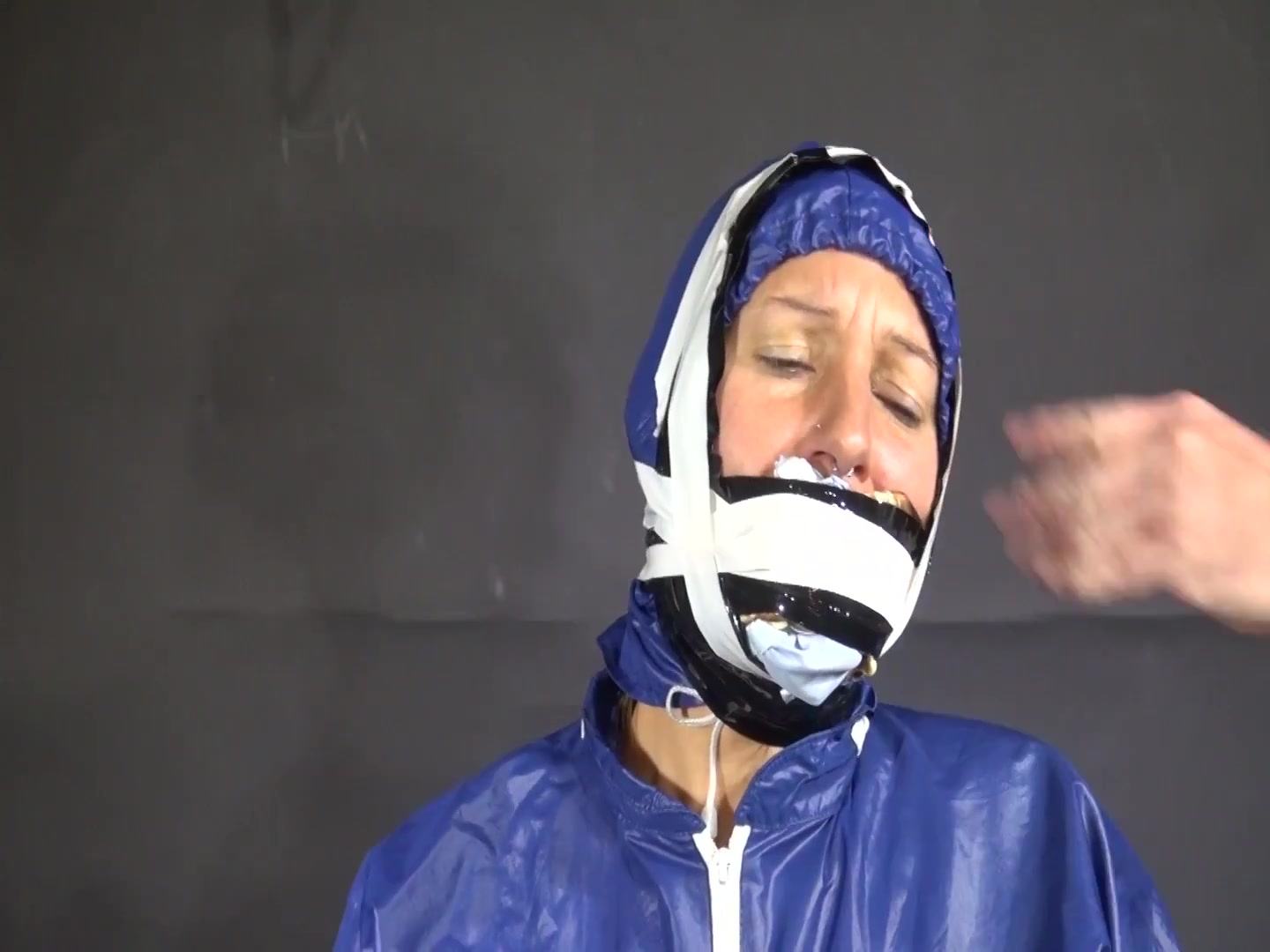Watch Sandra Beeing Bound, Pantygagged And Finally Pantyhooded In Her Shiny Nylon Rainwear