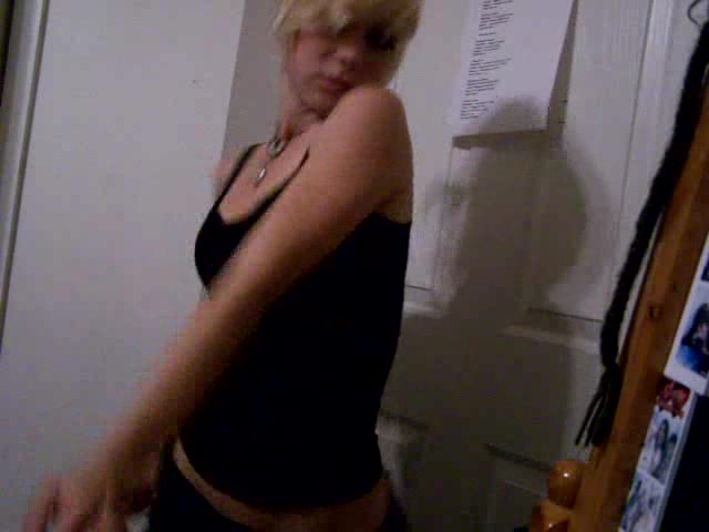 Short-haired blonde girl dances in the homemade video
