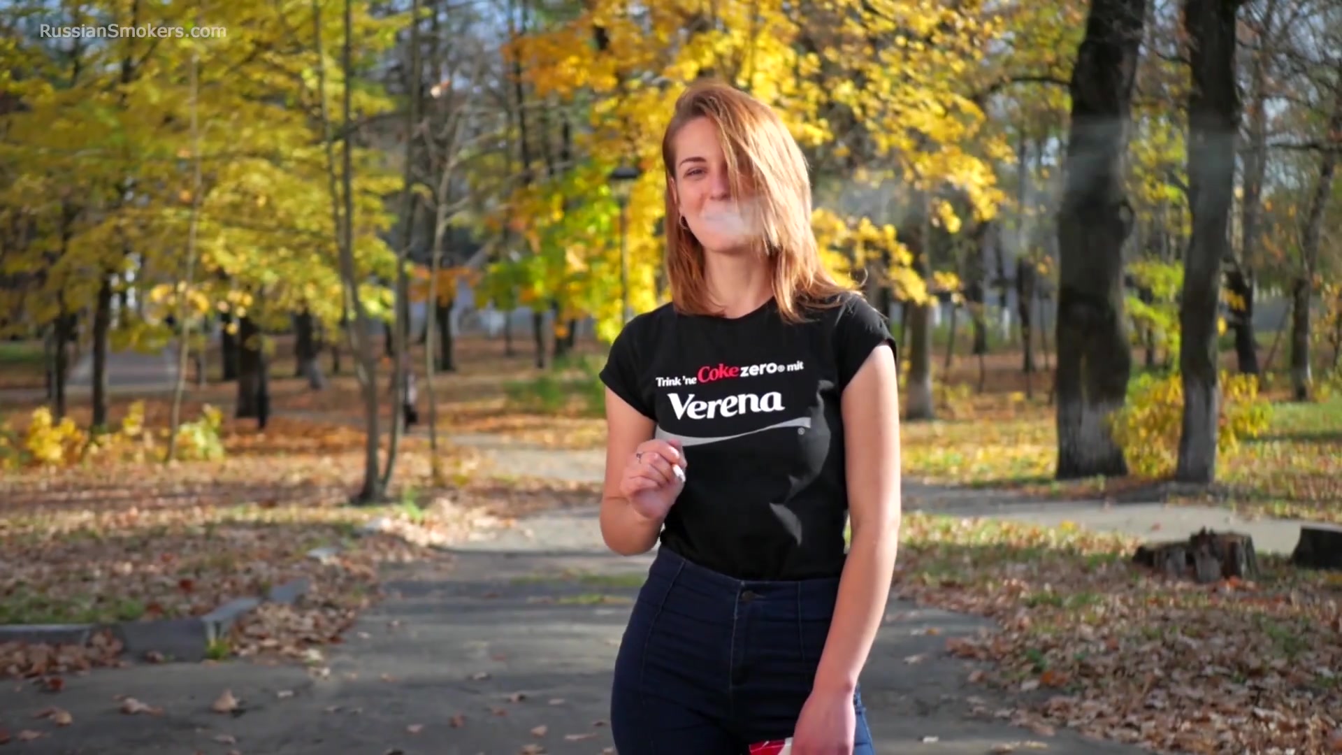 Sasha Is Smoking Two Cigarettes One By One In The Autumn Park