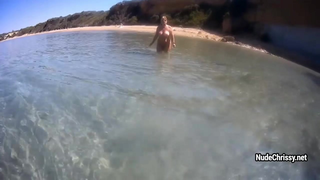 Nude Chrissy is posing in the sea and walking along-shore