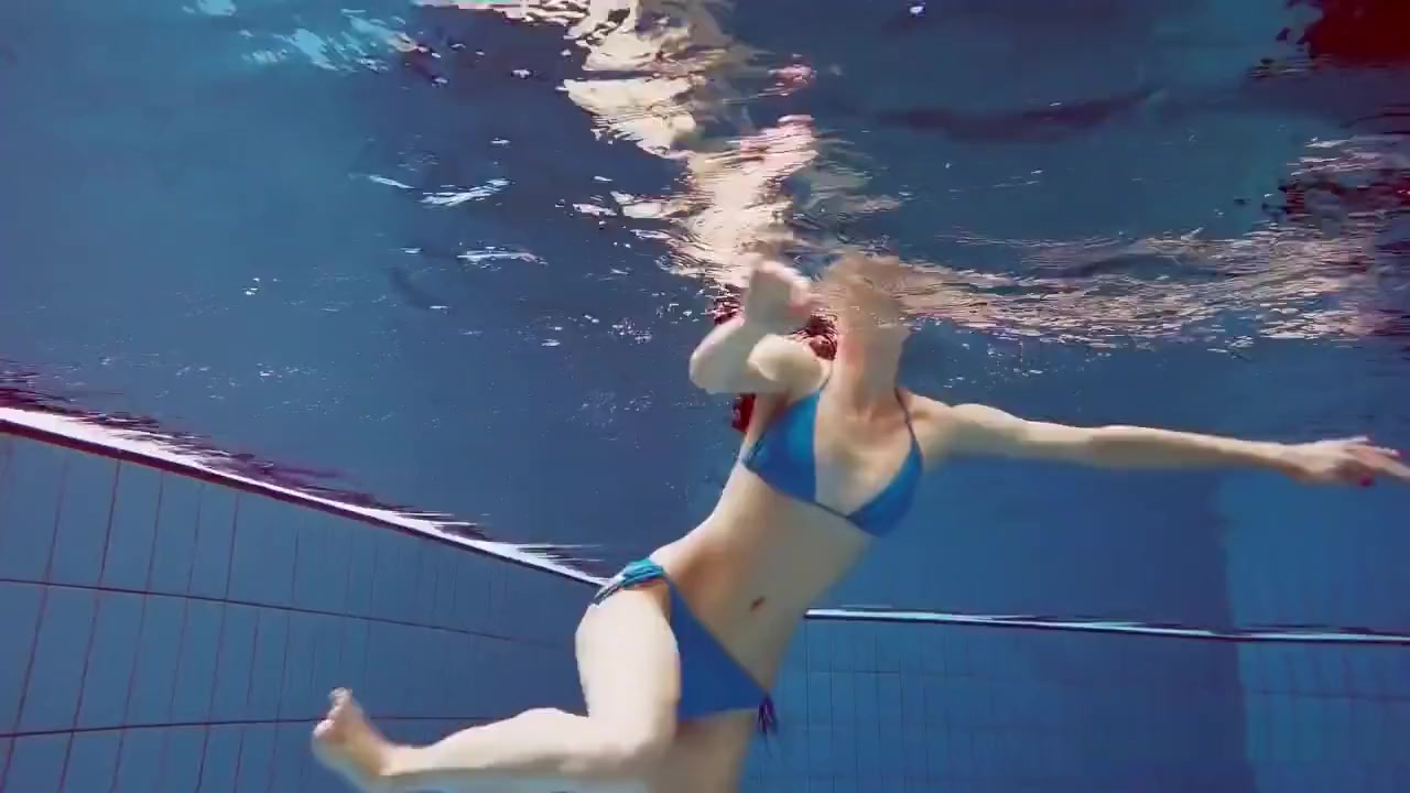Redhead In Blue Bikini Showing Her Body