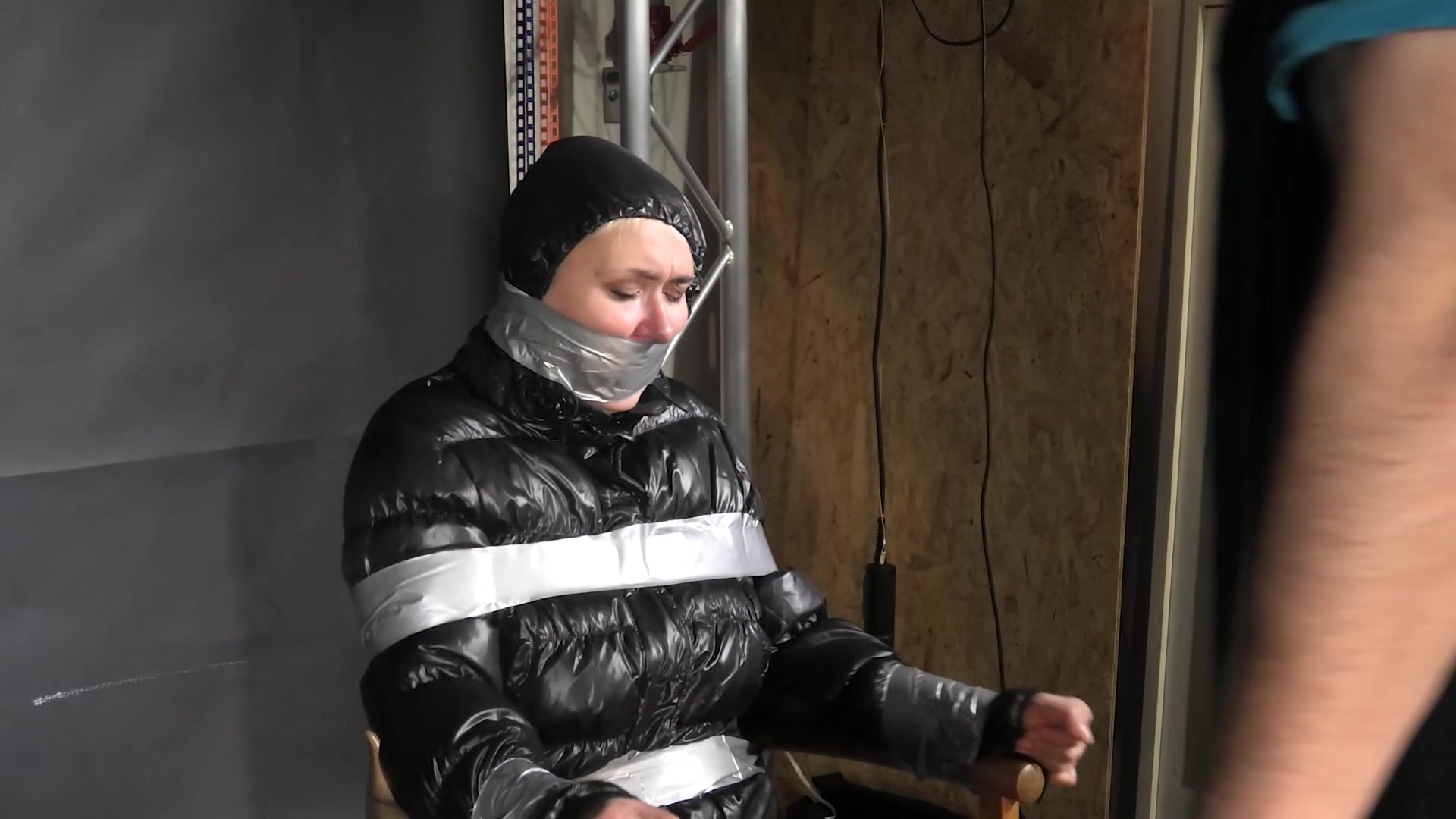 Alice Taped To A Chair And Tapegagged In Shiny Nylon Downjacket