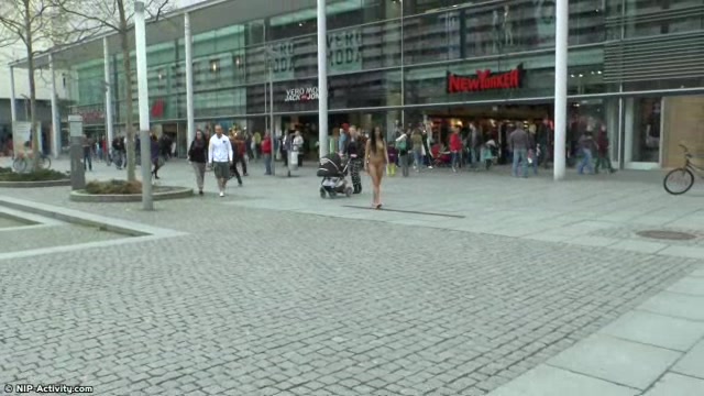 Long haired brunette walks naked in public in hd movie