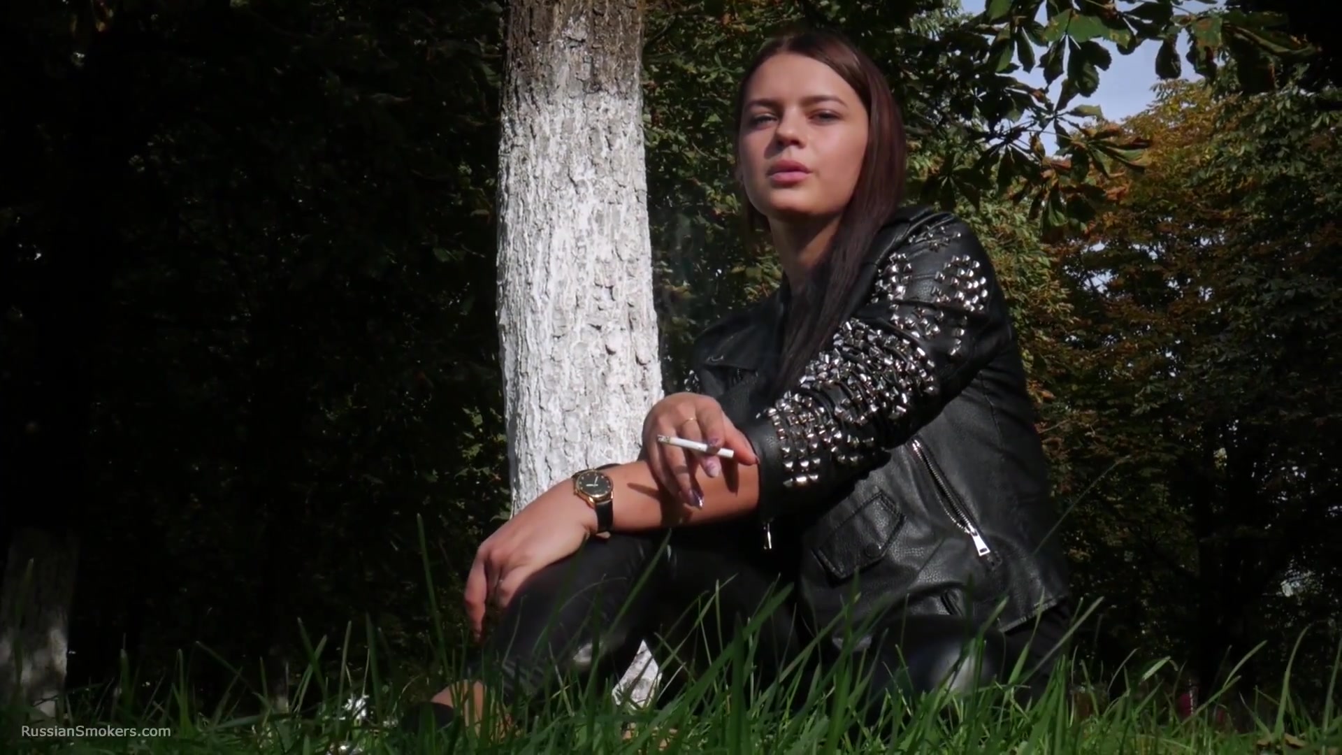 Pretty Faced Asya Is Smoking A Cigarette Outdoors