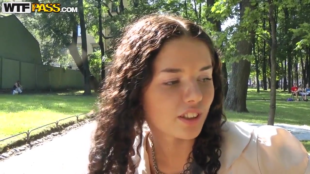 Cute curly brunette Leonora shows her boobs in park