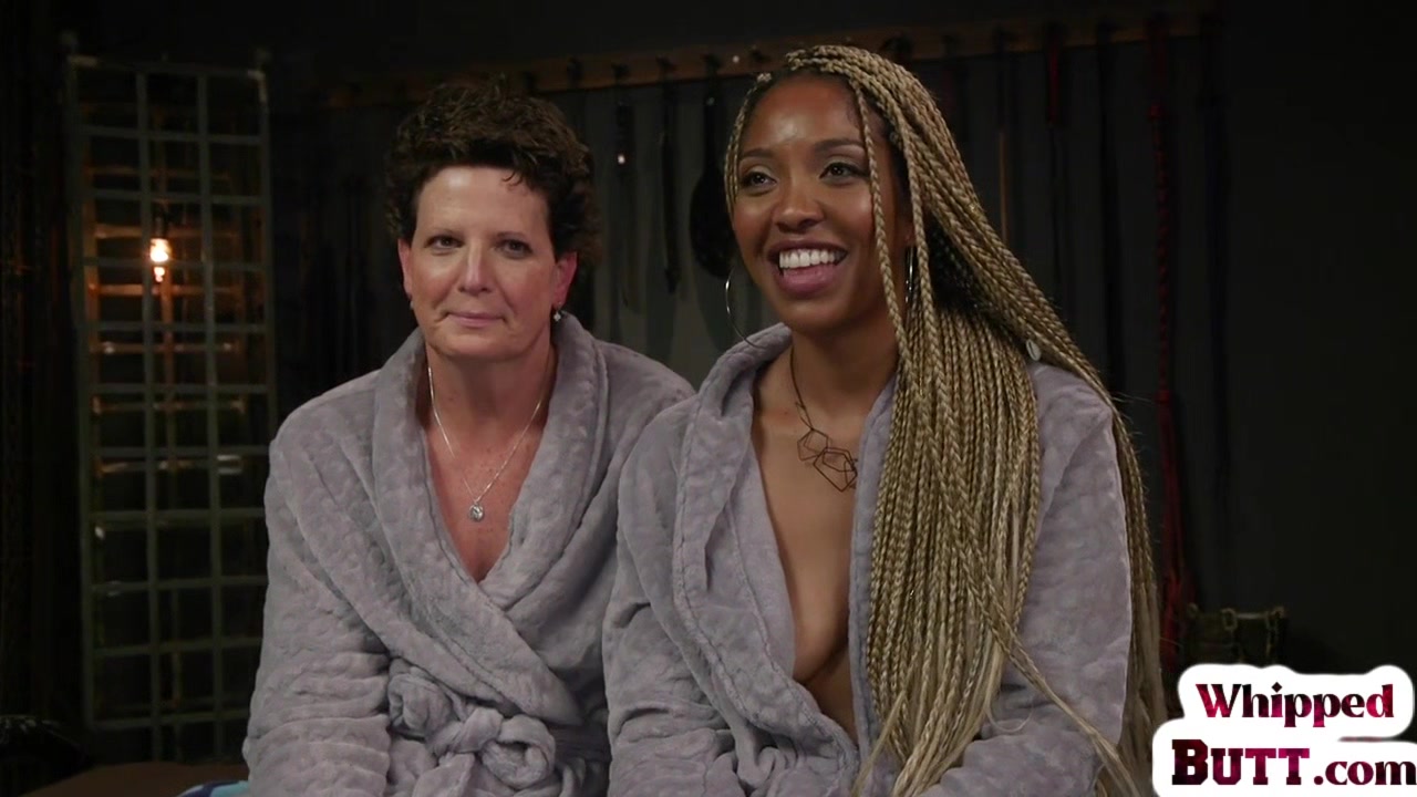 Whipping ebony dyke punishes trapped lesbian with toys