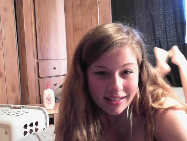 Blonde chick with big tits spreading her pussy lips wide