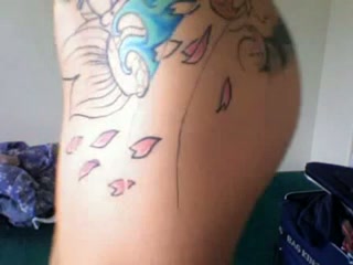 Tattooed latina taking shower and masturbating