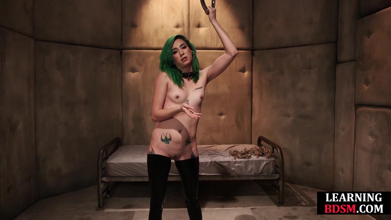 BDSM babe vibrates pussy while bound during masterclass