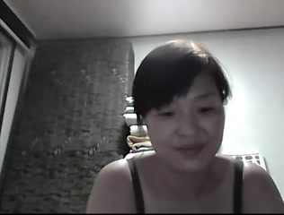 Wonderful mature Asian wife flashing her tits on camera