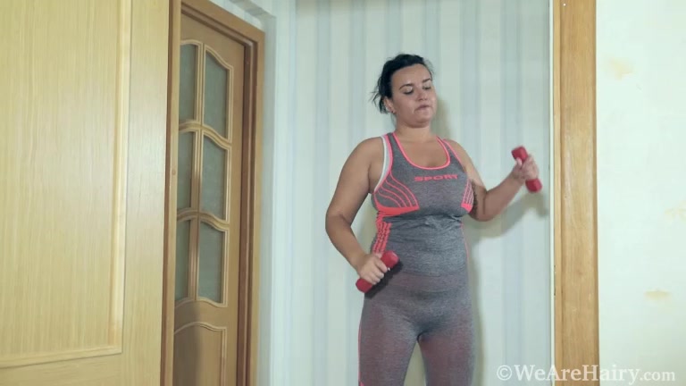 Ramira strips naked after a workout in her hallway