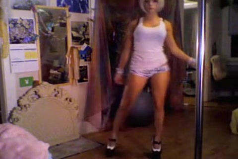 Beauty blonde showing her pole-dancing talent on camera
