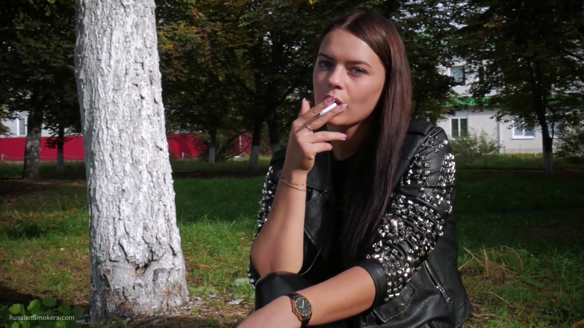Pretty Faced Asya Is Smoking A Cigarette Outdoors