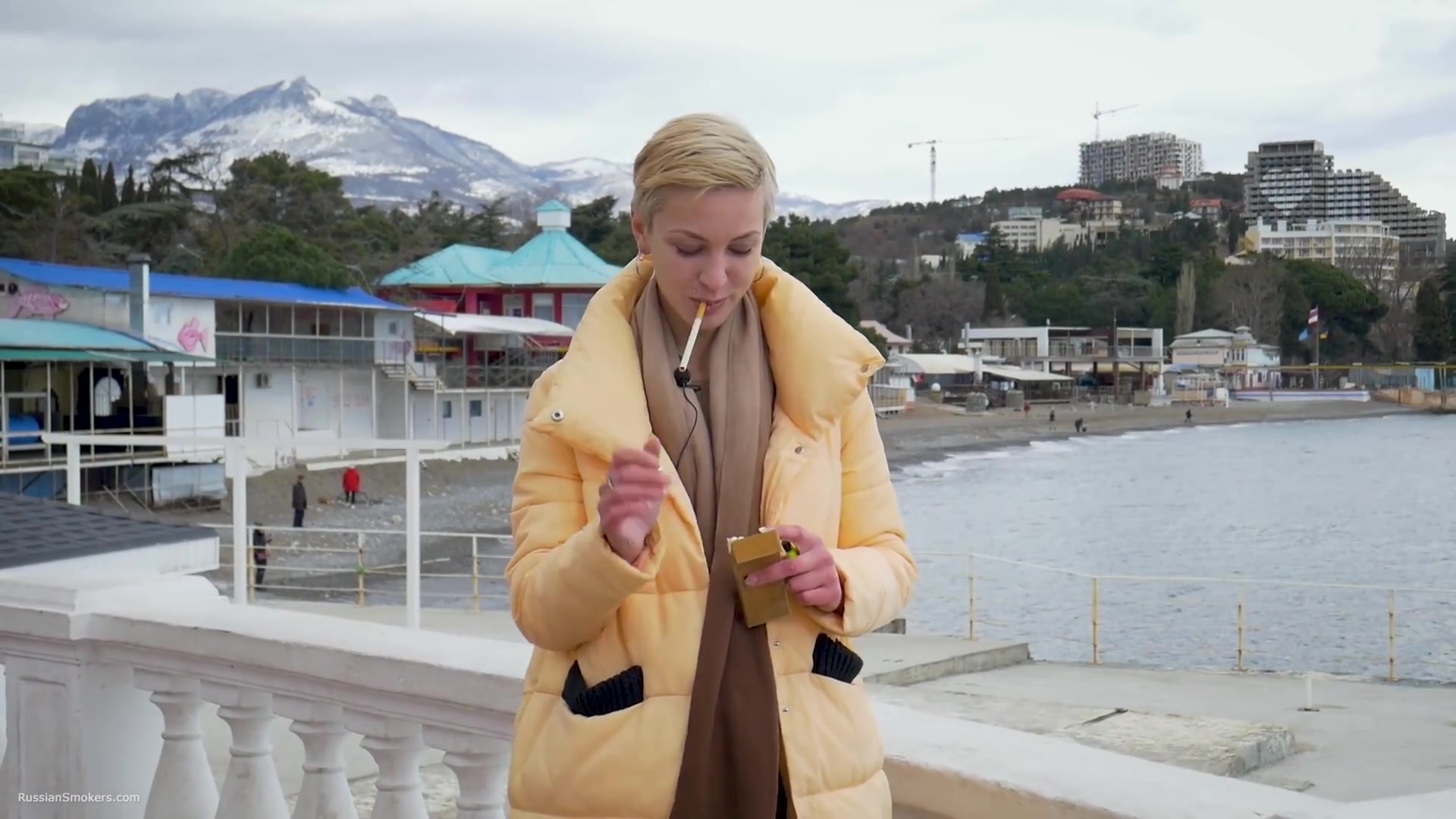Short Cut Hair Blonde Girl Is Smoking Two Cork Cigarettes