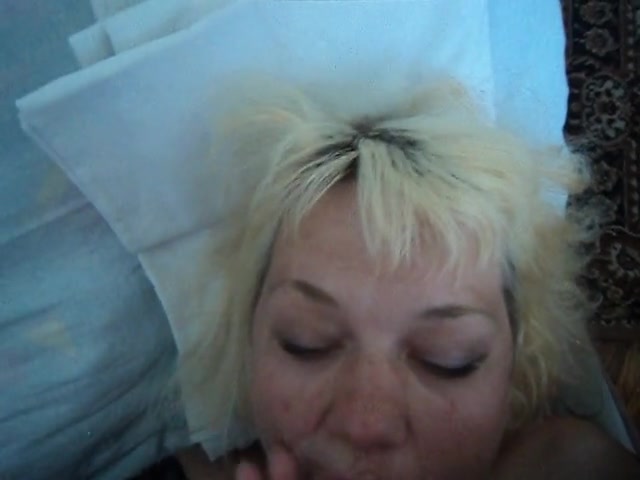 Mature blonde receiving a load of warm cum in her mouth