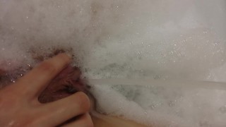 Girl is pissing in the pool while taking a bath extreme squirt