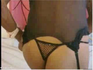 Gorgeous black-skinned lady dressing her sexy stockings
