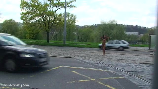 Delicious naked babe Angelica walks through the streets