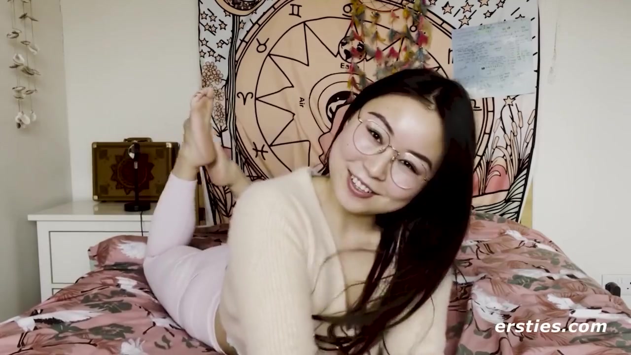 Cute Babe From China Rubs Her Shaved Pussy Before Grabbing A Dildo