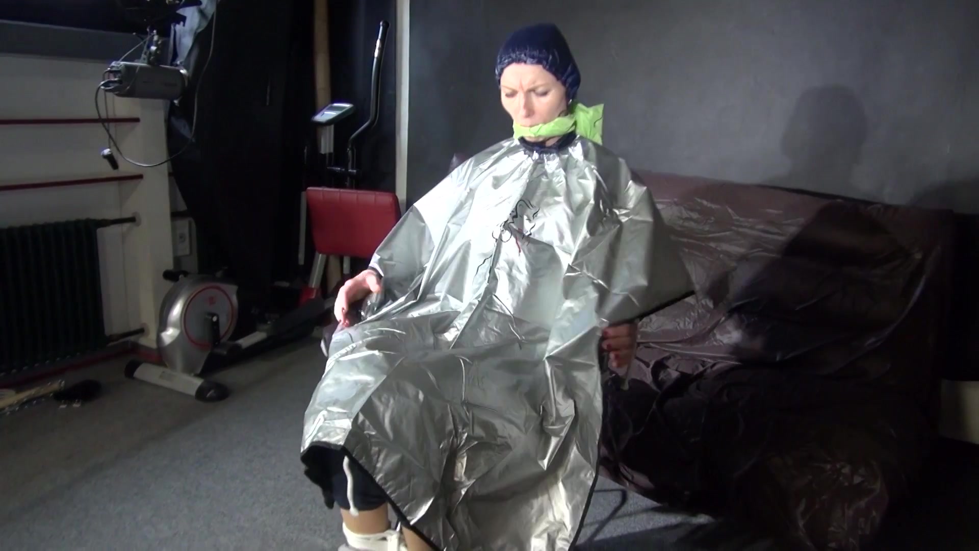 See Ronja Tied And Gagged On A Barber Chair In Shiny Nylon Rainwear And A Shiny Cape!