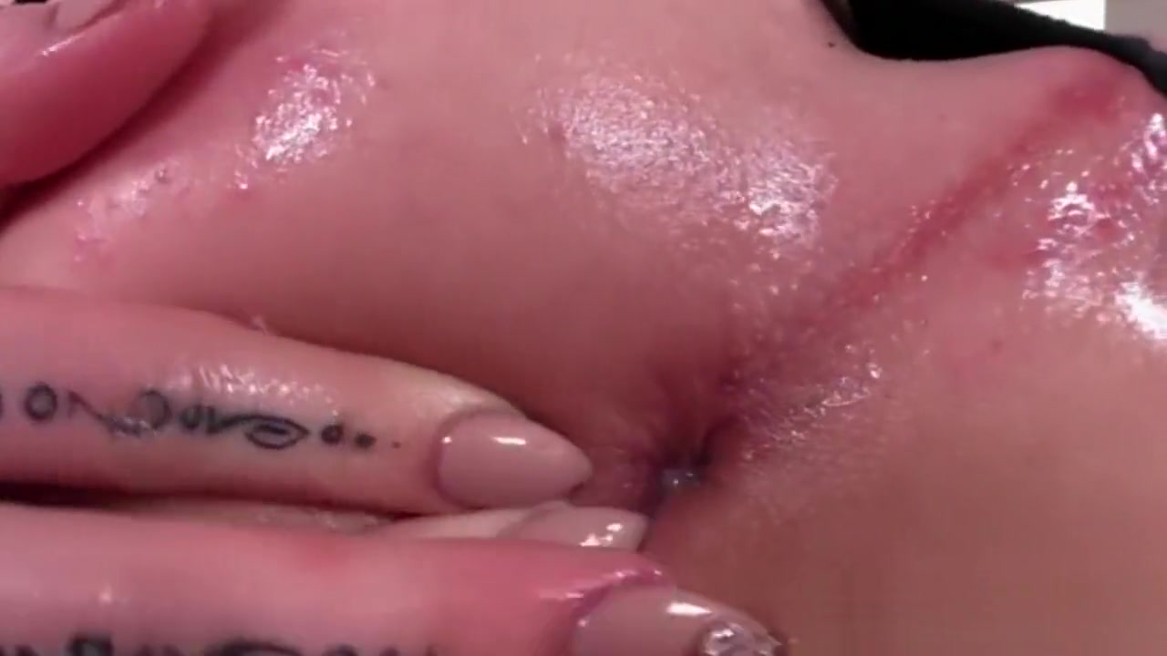 Tattooed shemale Vixxen Goddess shows off her sexy slender body
