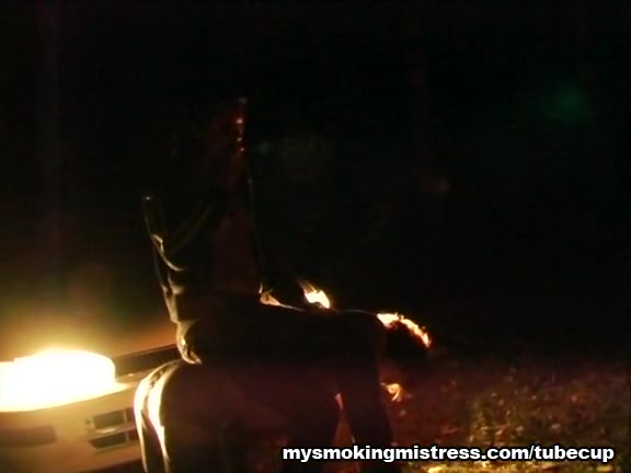 Smoking Mistress Sits on Slave