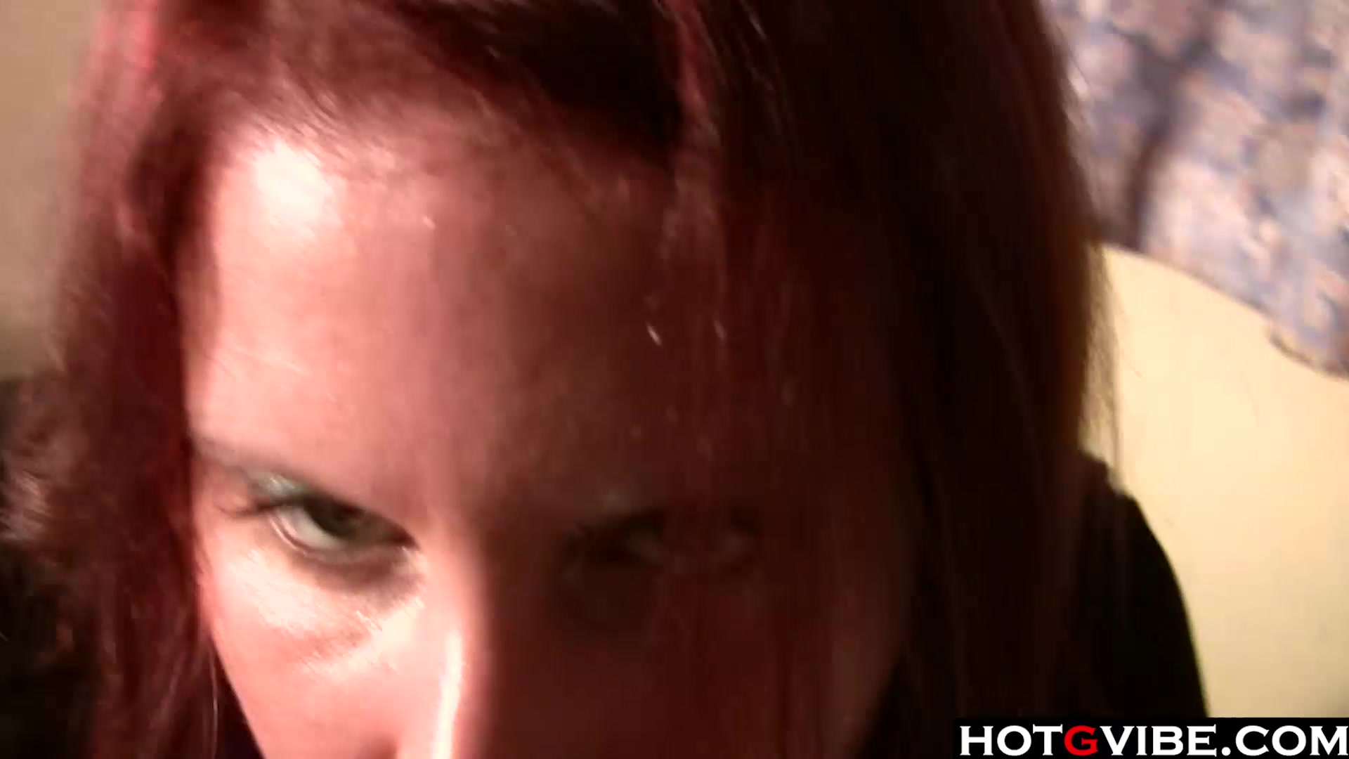 Busty redhead rides a dildo