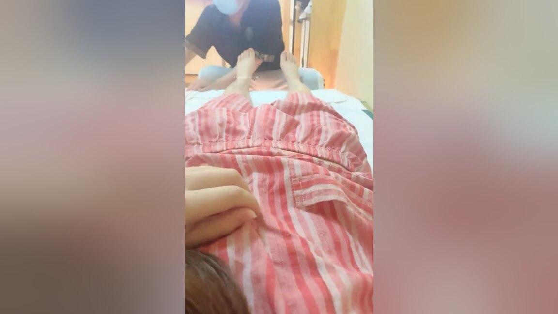 Asian masseur rubs clients clit and inserts her a sex toy