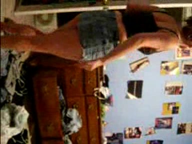 Blonde young girl taking her clothes off slowly