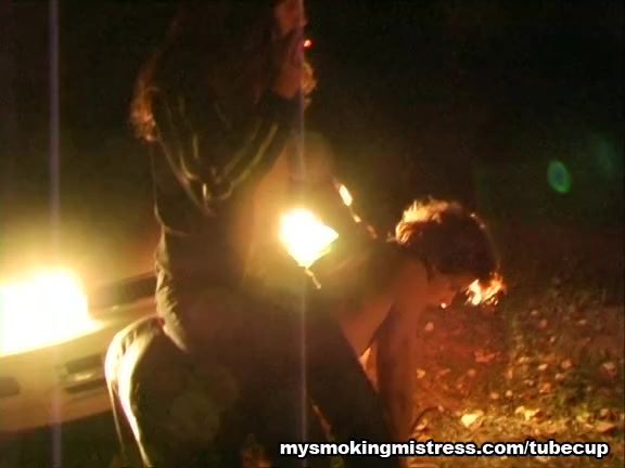 Smoking Mistress Sits on Slave