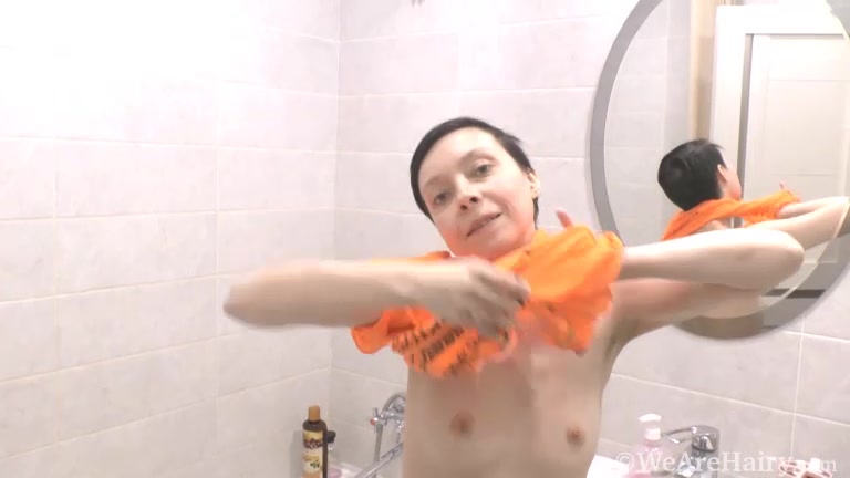 Trixie masturbates with her shower head