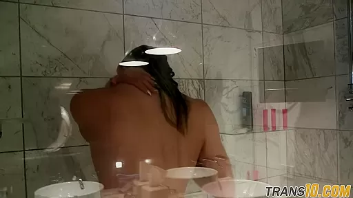 Smalltitted tranny showering while filmed