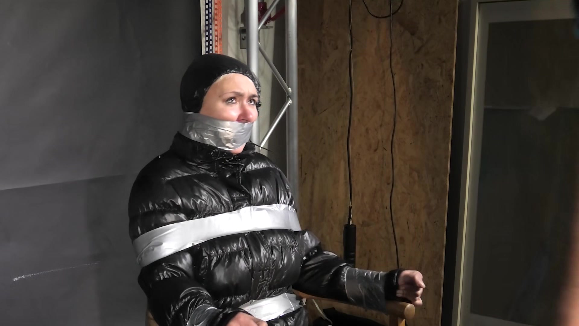 Alice Taped To A Chair And Tapegagged In Shiny Nylon Downjacket