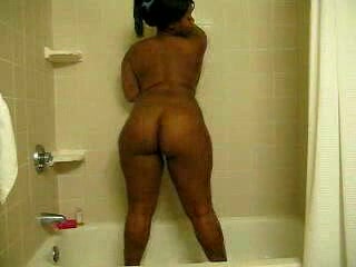 Ebony bitch with curves washes her brown twat in the shower