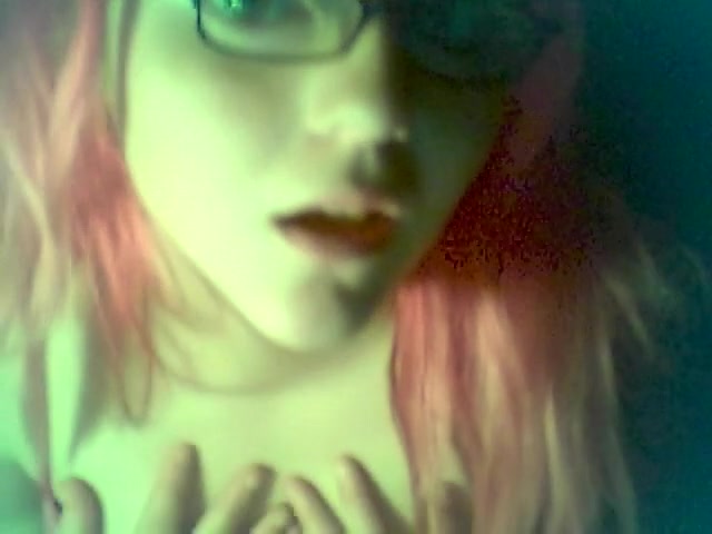 Red-haired emo babe showing her beautiful tits on camera