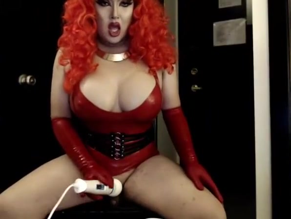 Asian Drag Queen jerks in red Latex