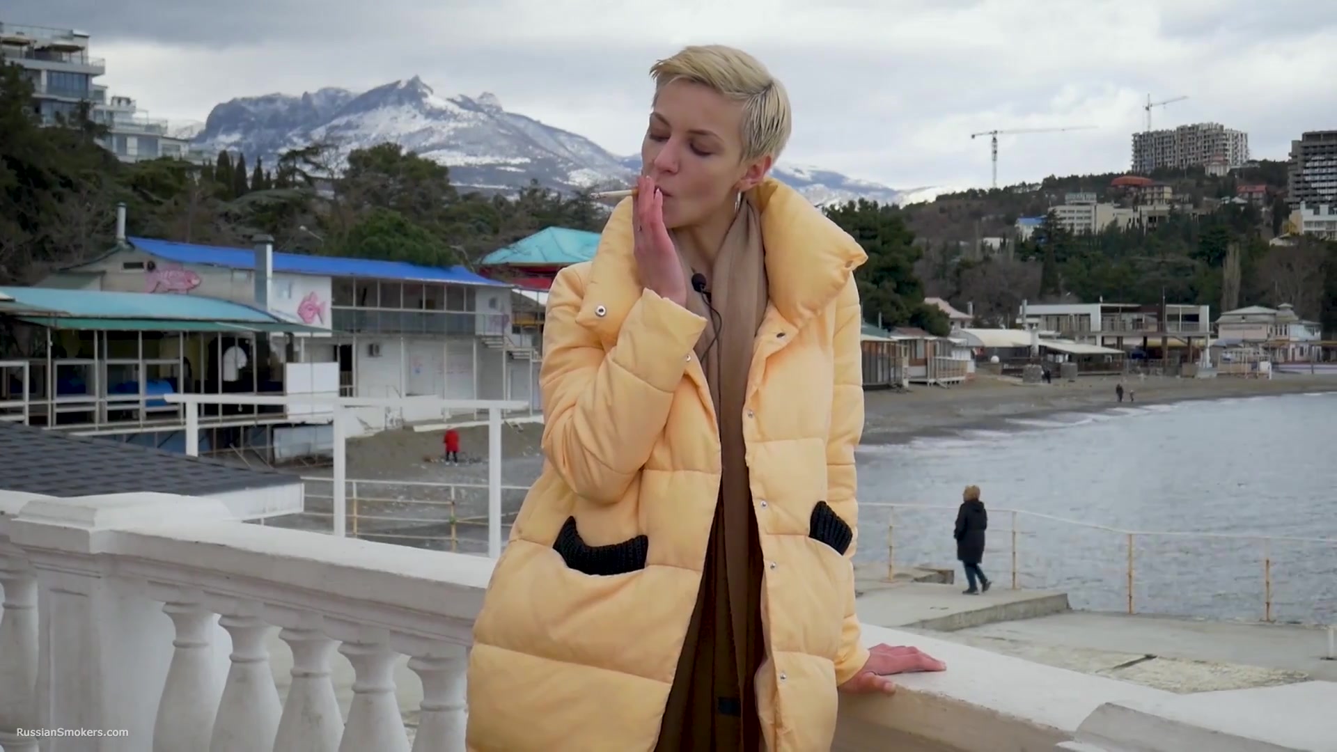Short Cut Hair Blonde Girl Is Smoking Two Cork Cigarettes