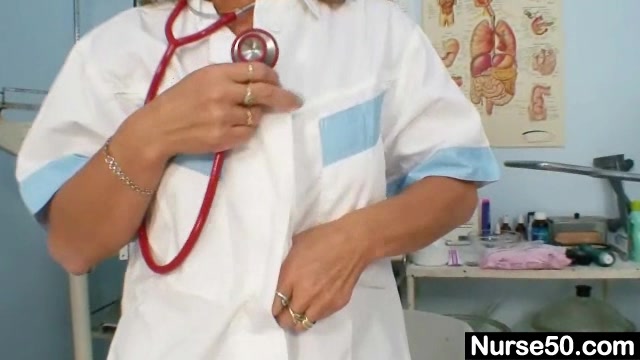 Skinny milf senior nurse toys her pussy on gynochair