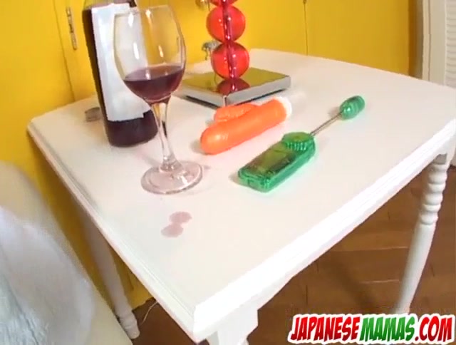 Mecumi plays with a stiff toy on her creamy love holes - More at Japanesemamas.com