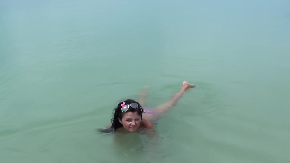 Tiffany in horny chick does oral sex on the beach scene