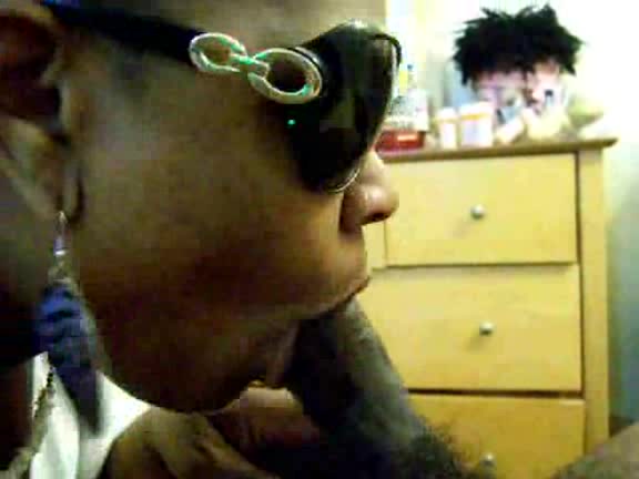 Black slut with sunglasses takes cock deep in her mouth